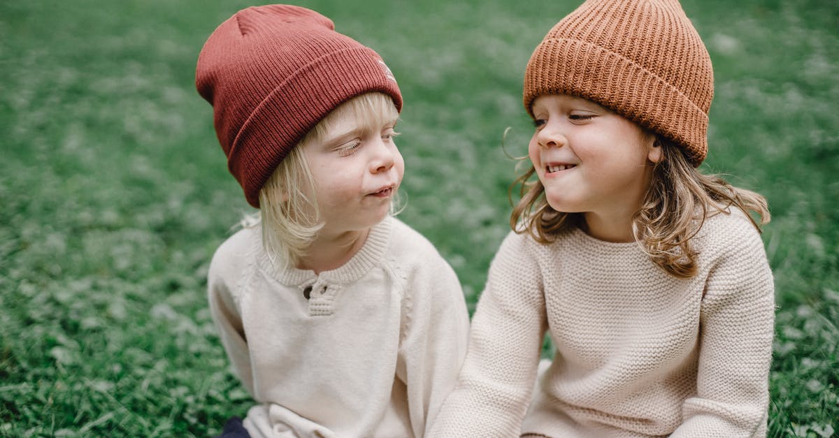 How can my brother and I add each other's contacts to our contact lists, most productively? - Adorable little girl and boy wearing hats looking at each other while sitting on grassy lawn in park against blurred background How can my brother and I add each other's contacts to our contact lists, most productively? - Adorable little girl and boy wearing hats looking at each other while sitting on grassy lawn in park against blurred background