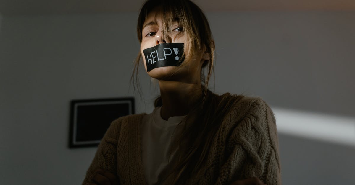 How can someone help me beat a Boss in Dark Souls Co-Op? - A Low Angle Shot of a Woman in Knitted Sweater Seeking for Help