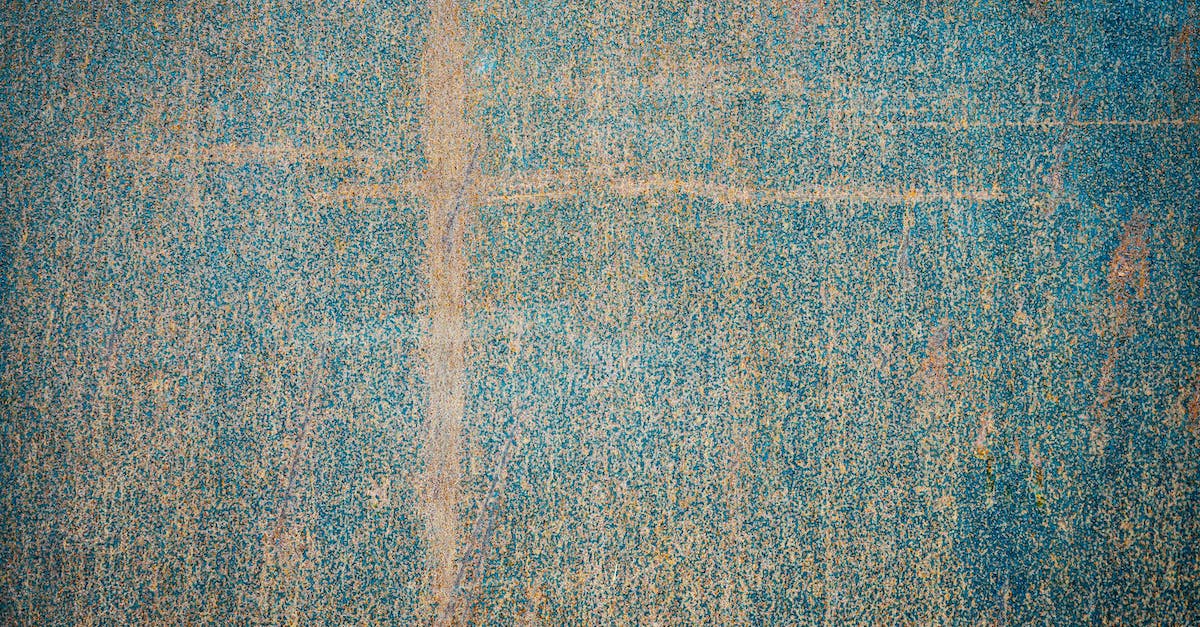 How can the damage value of elemental effects be weighed? - Top view of painted weathered surface with damaged patterns and scratches as abstract background