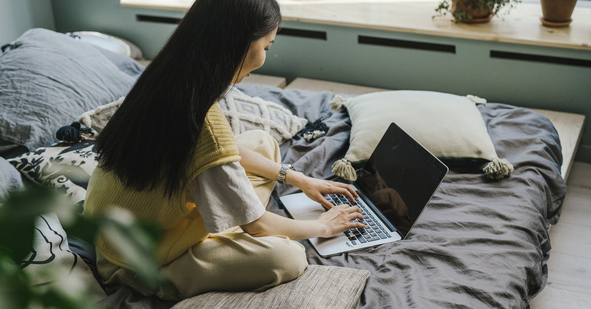 How can you be immune to damage from bed explosions in the nether/end? - Woman in Yellow Long Sleeve Shirt Using Black Laptop Computer