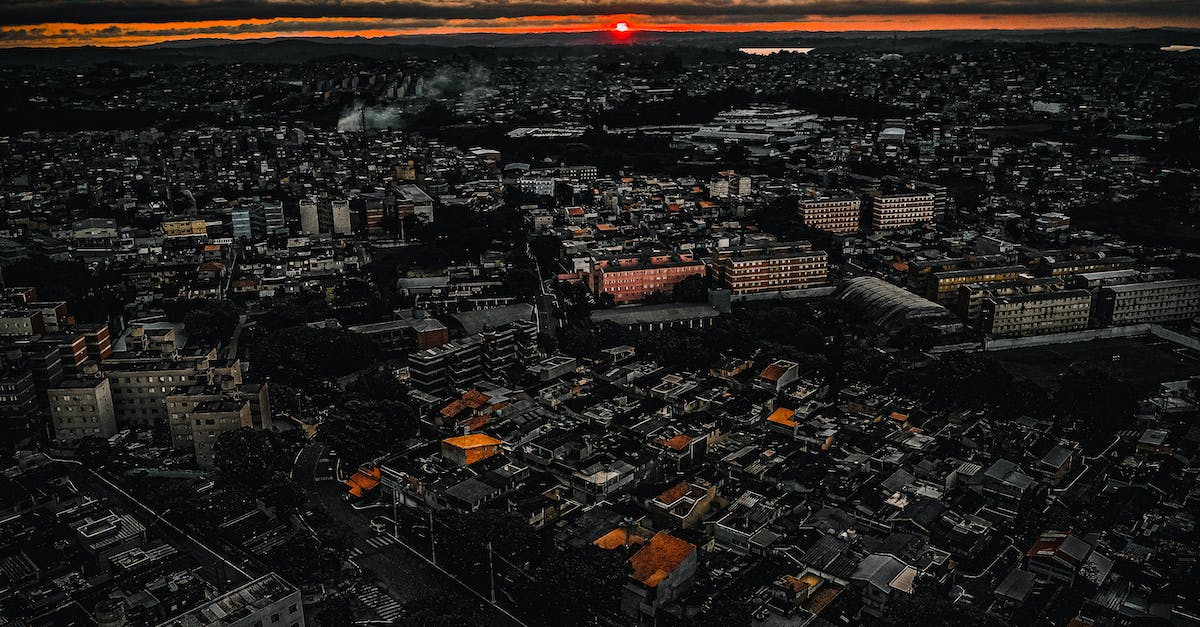 How can you get hard mode in Golden Sun the Lost Age without completing the game? - Drone view of dense old houses of industrial town in picturesque golden setting sun in cloudy sky How can you get hard mode in Golden Sun the Lost Age without completing the game? - Drone view of dense old houses of industrial town in picturesque golden setting sun in cloudy sky