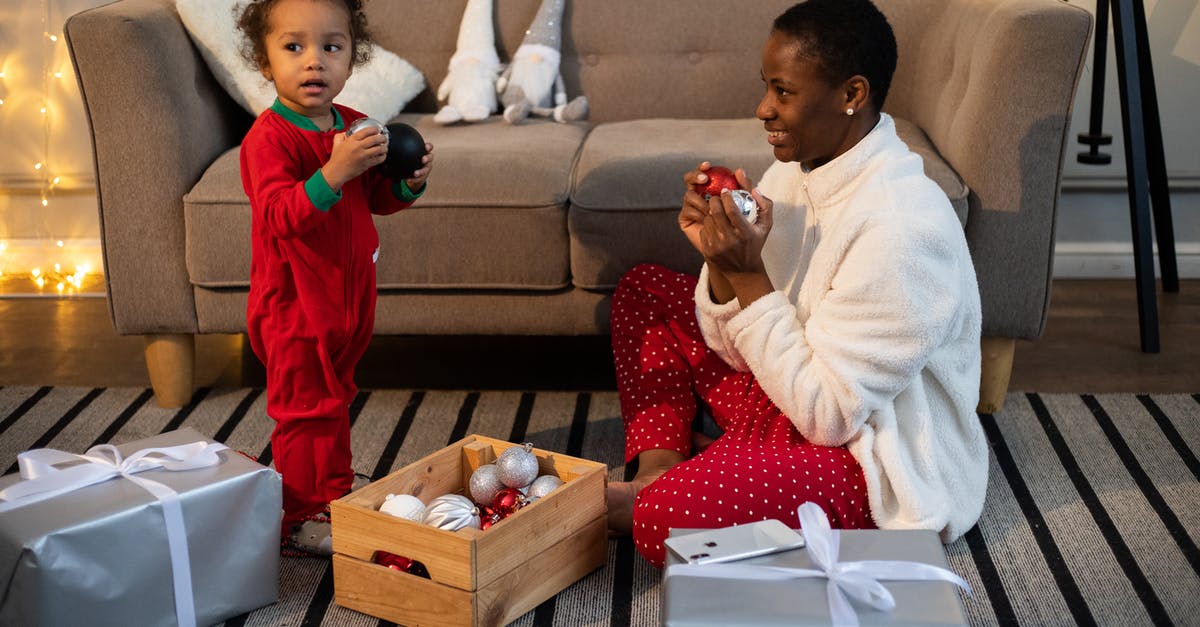 How can you tell if a crate is explosive in the Testing Area? - Boy in White Long Sleeve Shirt Sitting Beside Girl in Red and White Pajamas