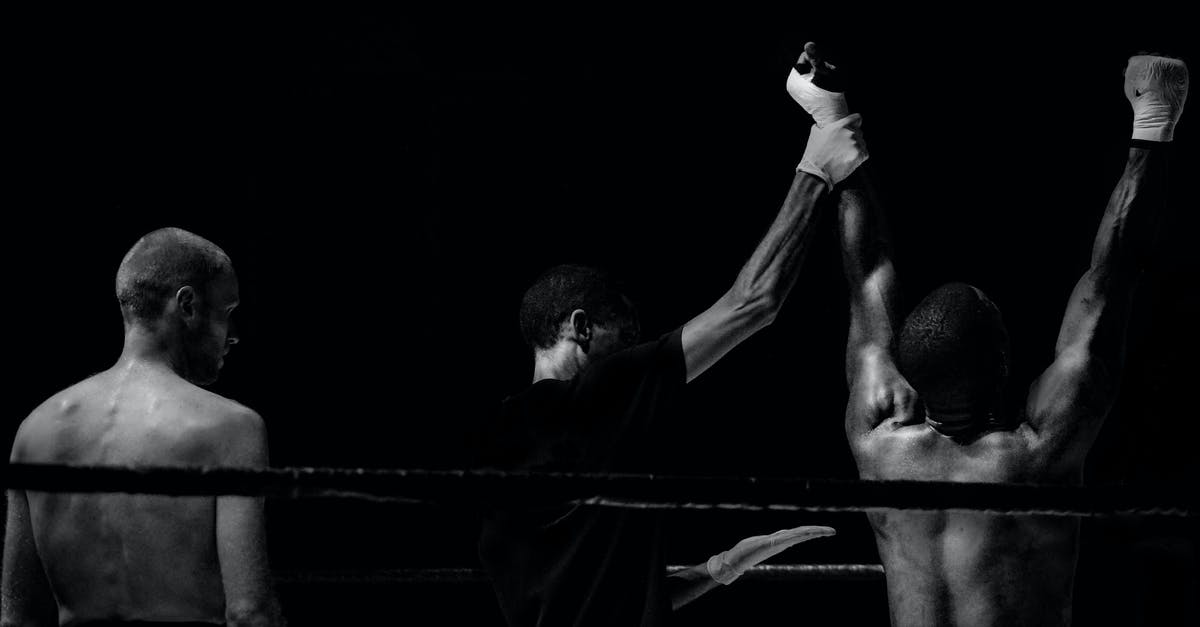 How come I lose the game when all hosts die, even if I have the Necrosis upgrade? - Grayscale Photography of Man Holding Boxer's Hand Inside Battle Ring