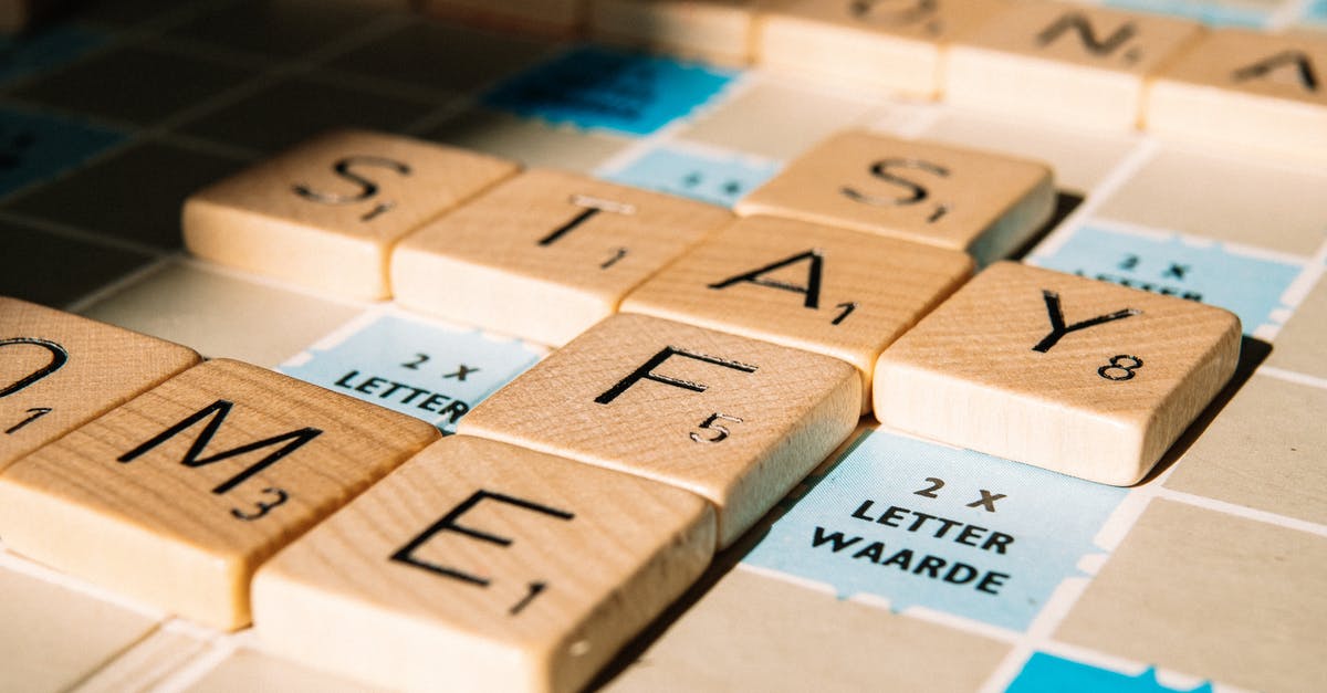 How could i make a command block message when Zombie died? - Letter tiles of board game on table