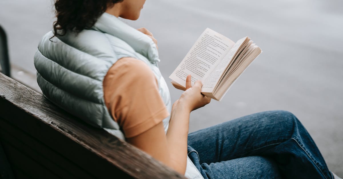 How did Cloud learn how to fight? - Side view of crop anonymous young female in casual clothes reading interesting book while resting on bench in park