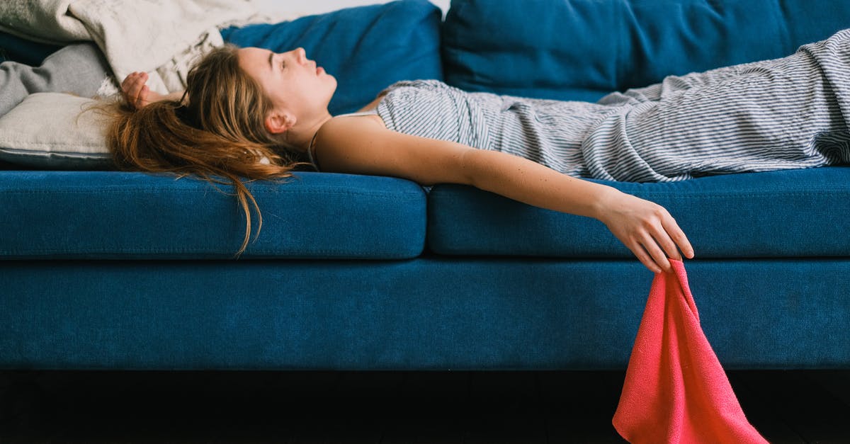 How did I break the fabric of time? - Tired housewife resting on sofa after housework