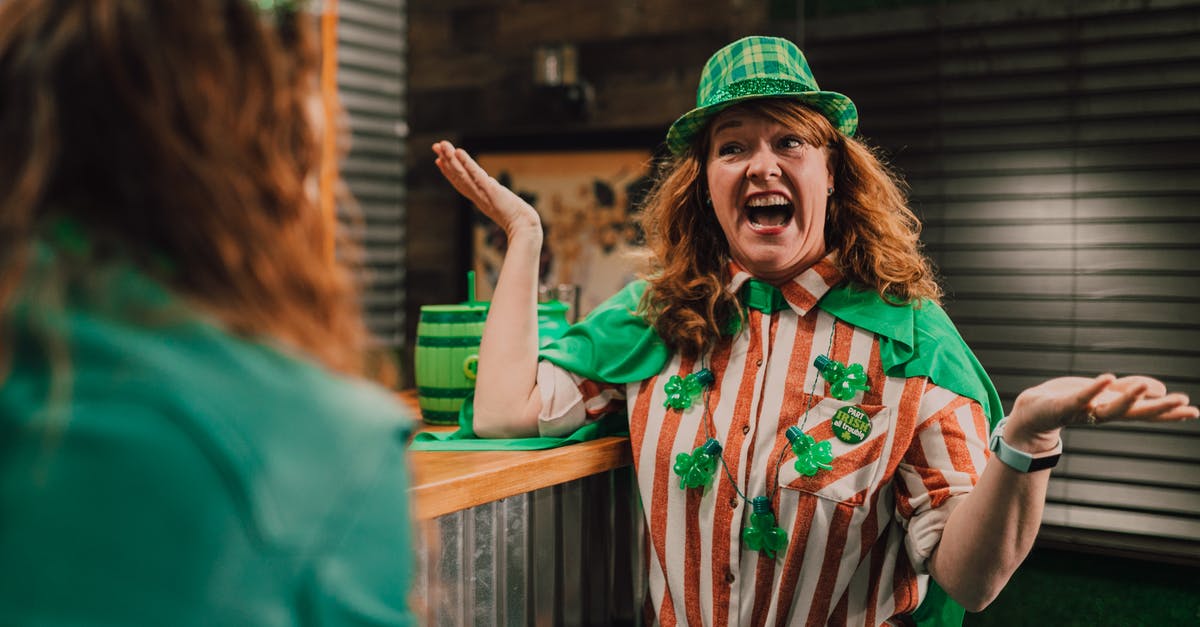 How did Junpei know Snake and Clover were abducted together? - Cheerful adult female with curly red hair yelling and shrugging while chatting with unrecognizable friend in bar during Saint Patricks Day How did Junpei know Snake and Clover were abducted together? - Cheerful adult female with curly red hair yelling and shrugging while chatting with unrecognizable friend in bar during Saint Patricks Day