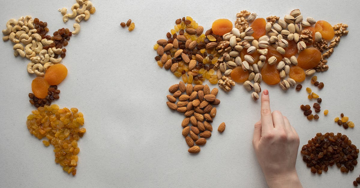 How different is Demo world from a regular world? - Faceless person making world map with nuts and dried fruits How different is Demo world from a regular world? - Faceless person making world map with nuts and dried fruits