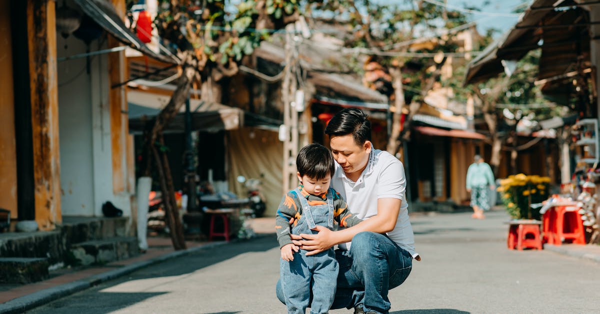 How do automatically launch Minecraft, skip pressing the play button, and just have it go straight to the menu? - Young ethnic father with little son spending time together in town