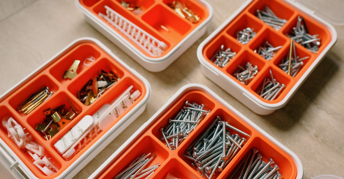 How do Crimson/Demon Altars crafting work? - From above of boxes with different metal nails and plastic dowels in workshop