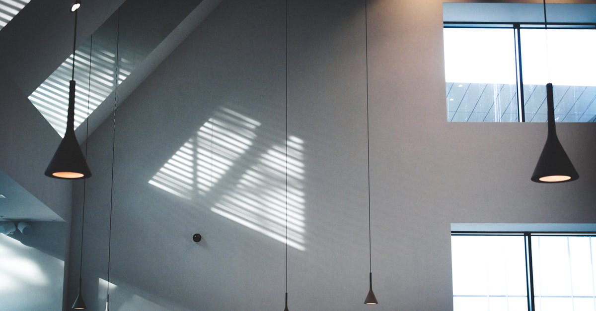 How do Faulty Lamps work? - Black Pendant Lamps in White Building How do Faulty Lamps work? - Black Pendant Lamps in White Building