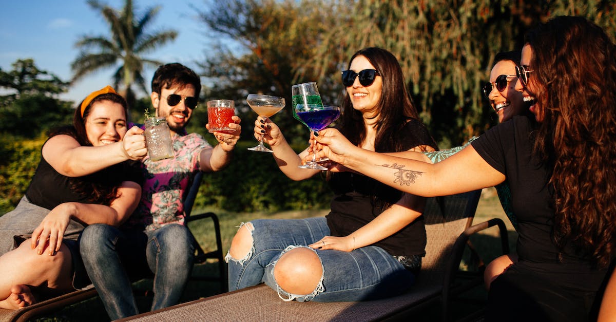 How do gang claims interact with the alcoholics group therapy program? - Group of friends drinking alcoholic beverages in park How do gang claims interact with the alcoholics group therapy program? - Group of friends drinking alcoholic beverages in park