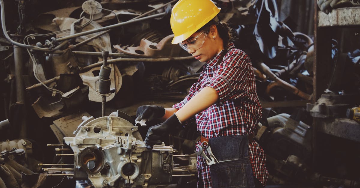 How do get Genocide in Hard Mode? - Woman Wears Yellow Hard Hat Holding Vehicle Part