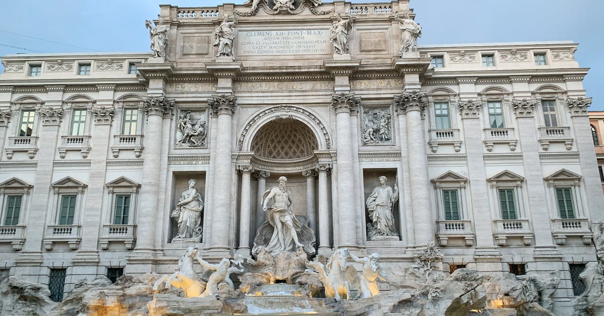 How do Grand Prix Ranking work? - Majestic stone building and fountain with sculptures at dusk