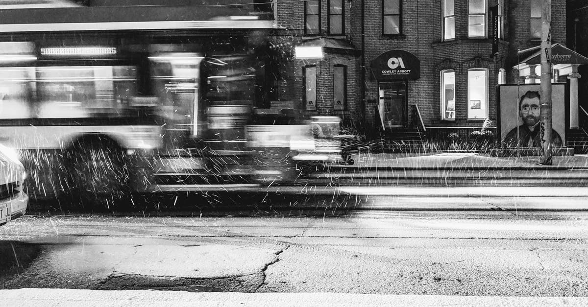 How do I access bus decals DLC? - Grayscale Photo of Cars on Road Near Building How do I access bus decals DLC? - Grayscale Photo of Cars on Road Near Building