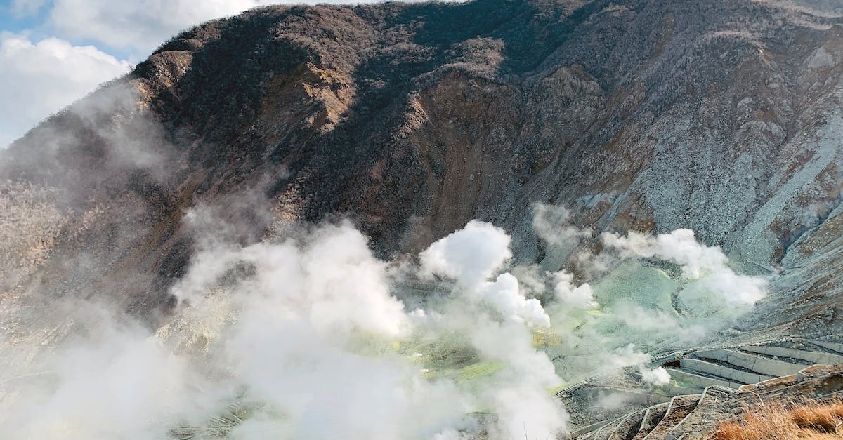 How do I activate a Prison Architect steam code? - Scenic view of active volcano with smoking mist over rough rocky valley in Hakone Japan