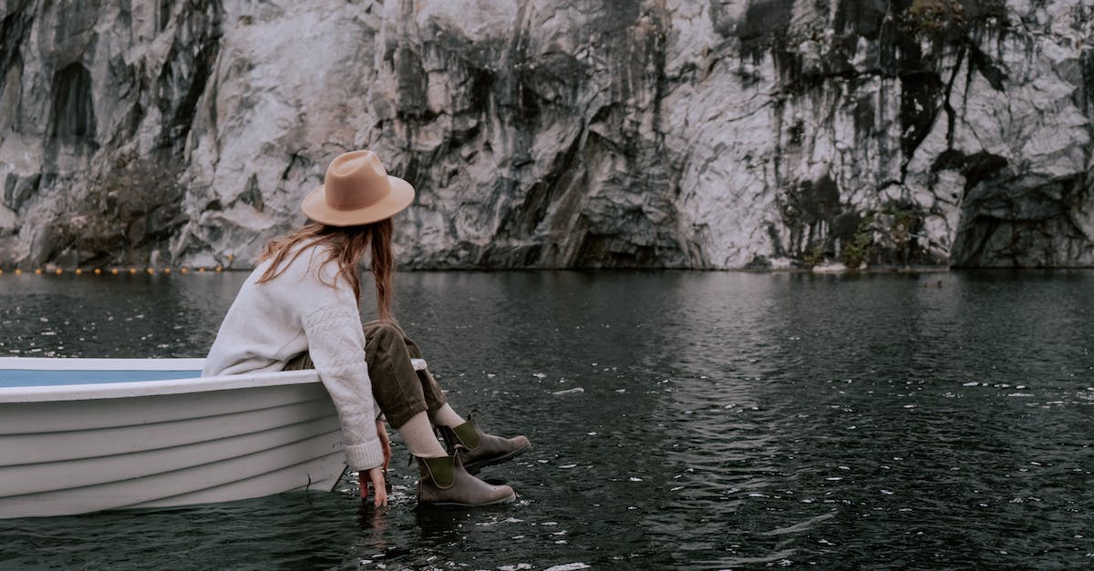 How do I add a tourist to a vessel in KSP - A Woman Sitting on the Boat while Looking at the Rock Formation