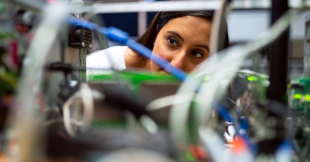 How do I advance time? - Photo Of Female Engineer Looking Through Wires