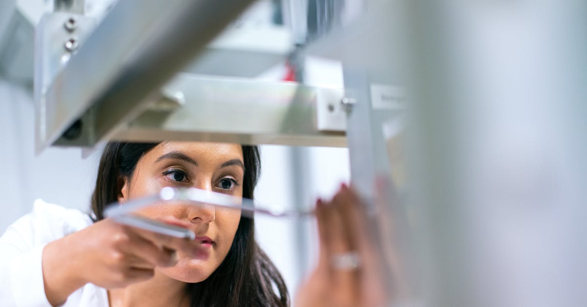 How do I advance time? - Photo Of Female Engineer Working On An Equipment 