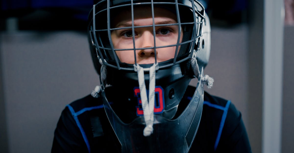 How do I apply a specific command to a player wearing certain gear? [duplicate] - A Boy Wearing a Hockey Helmet