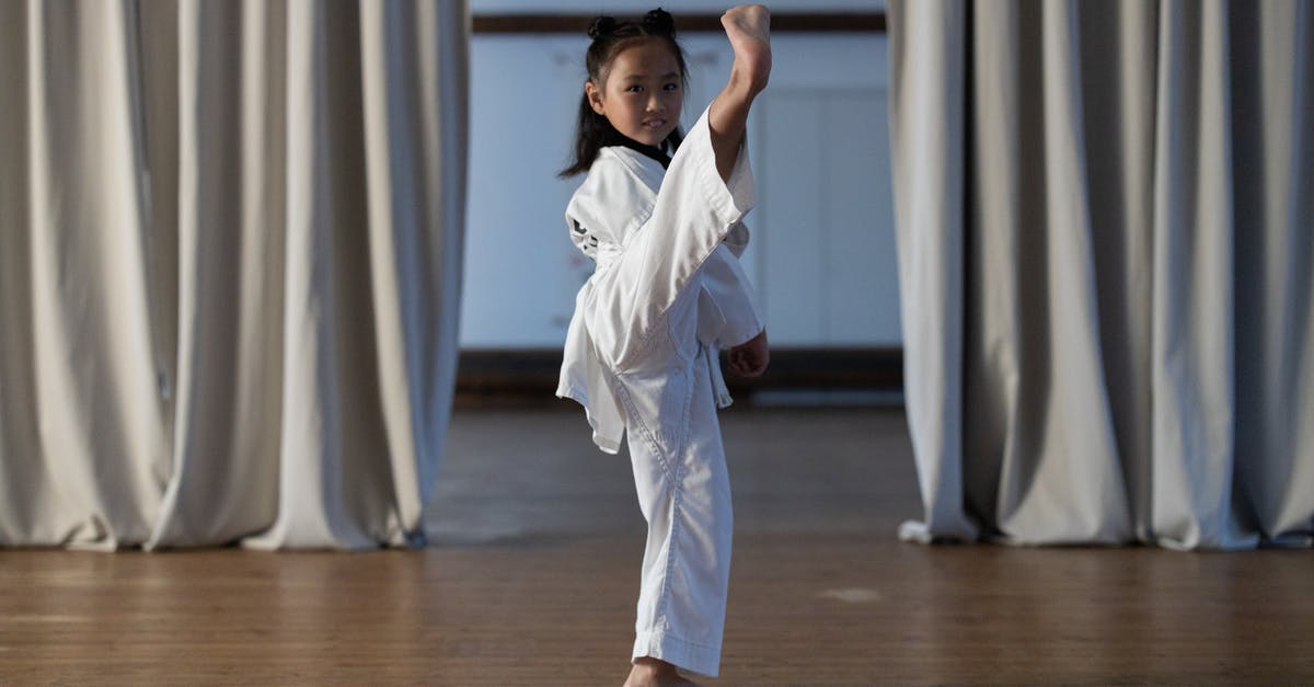 How do I avoid blocked kicks? - Cute Girl Doing High Kick
