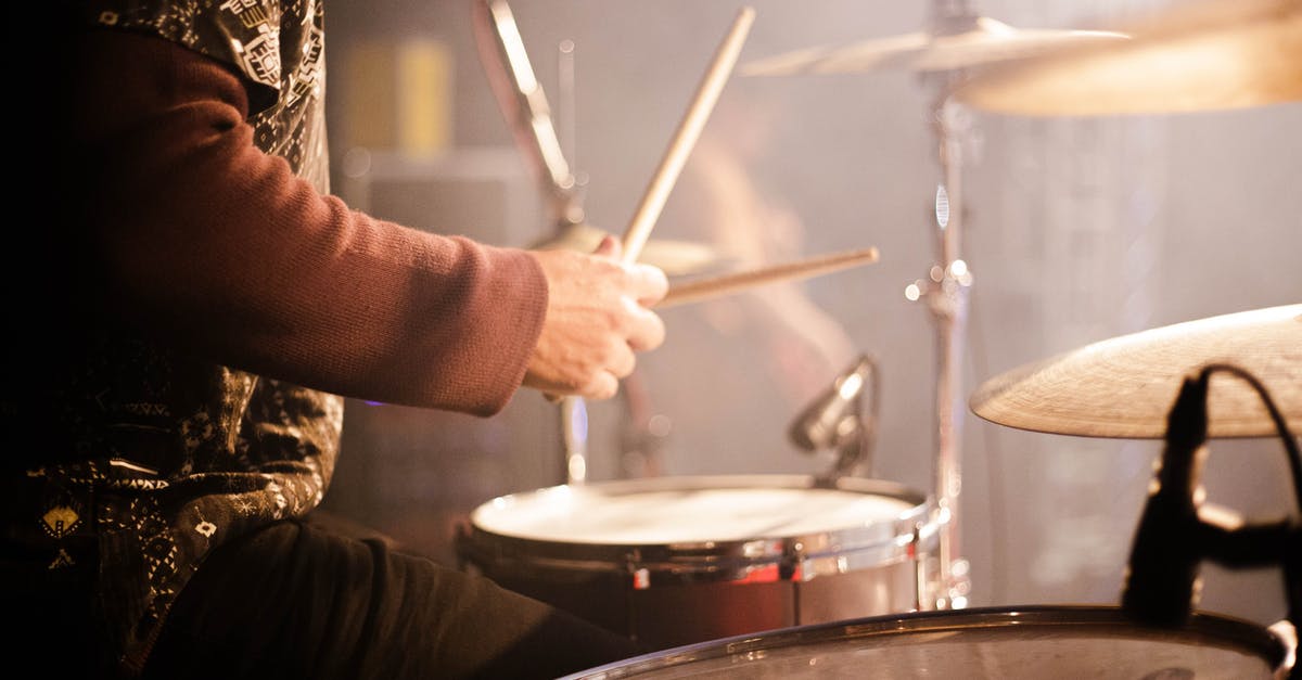 How do I beat the 'Pogo Party' minigame? - Side view crop anonymous male musician playing drums during live concert on concert stage How do I beat the 'Pogo Party' minigame? - Side view crop anonymous male musician playing drums during live concert on concert stage