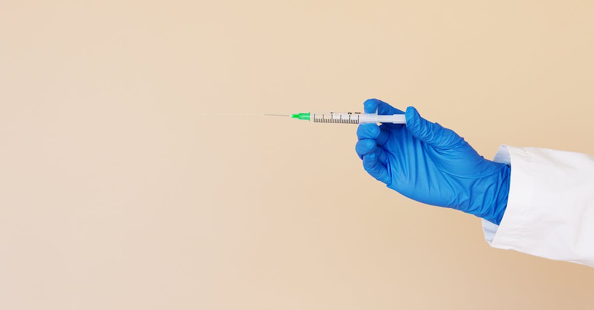 How do I become an honorary member in the white glove society? - Crop nurse with syringe on beige background