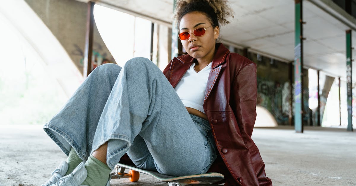 How do I become fierce deity early? - Man in Red Blazer and Blue Denim Jeans Sitting on Sidewalk How do I become fierce deity early? - Man in Red Blazer and Blue Denim Jeans Sitting on Sidewalk