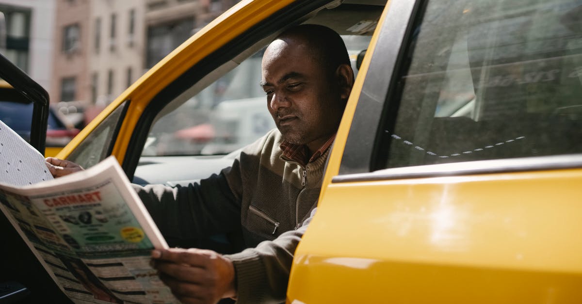 How do I break a Shadow Orb? - Concentrated male driver in casual clothes sitting in taxi during break and reading newspaper How do I break a Shadow Orb? - Concentrated male driver in casual clothes sitting in taxi during break and reading newspaper