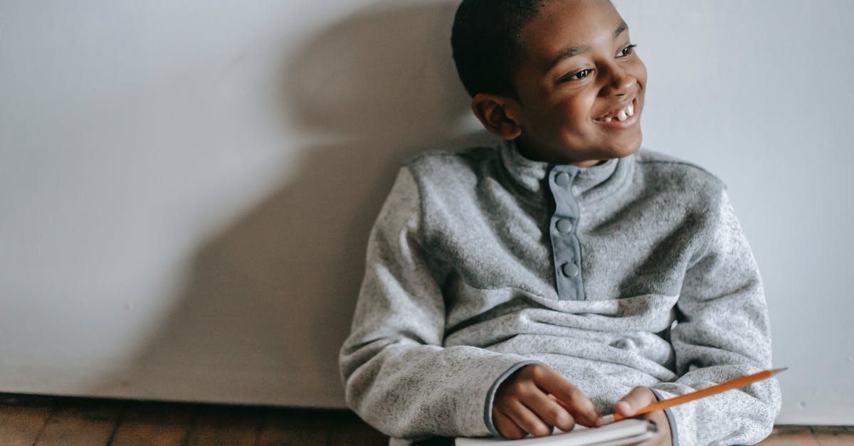 How do I break a Shadow Orb? - Happy African American boy sitting on floor with copybook and pencil How do I break a Shadow Orb? - Happy African American boy sitting on floor with copybook and pencil
