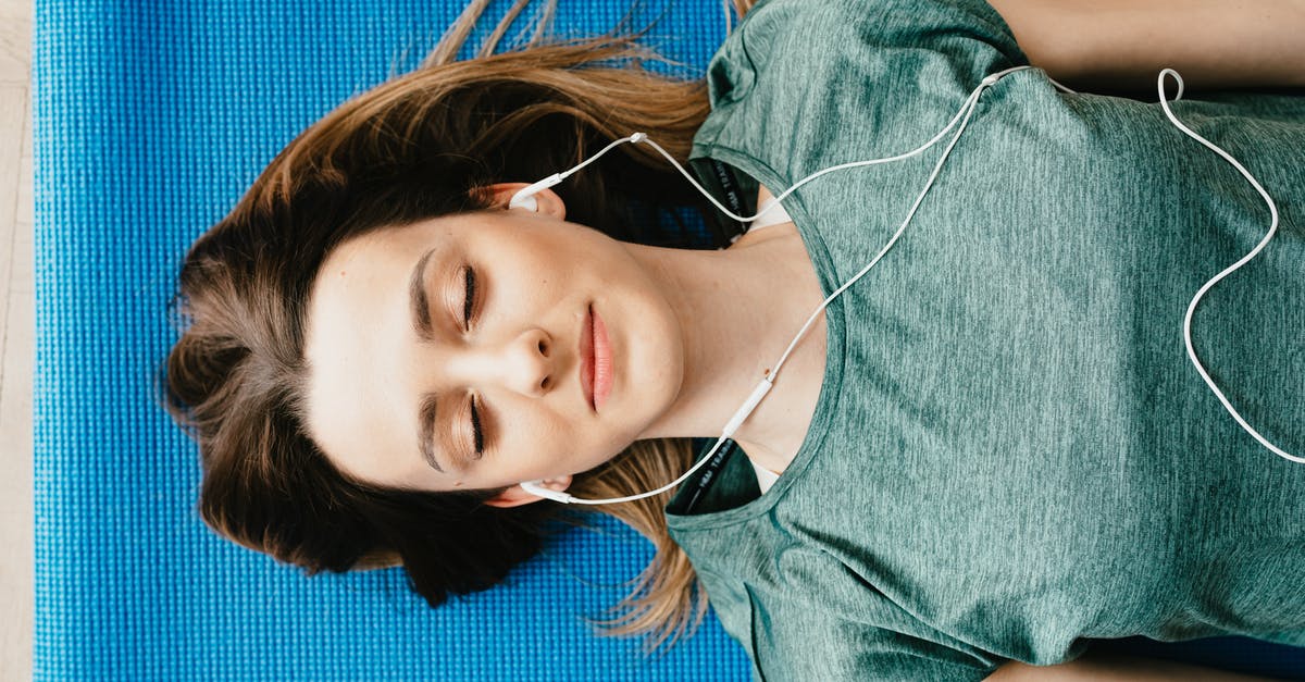 How do I break into houses in GTA V? - Tranquil woman resting on yoga mat in earphones at home How do I break into houses in GTA V? - Tranquil woman resting on yoga mat in earphones at home