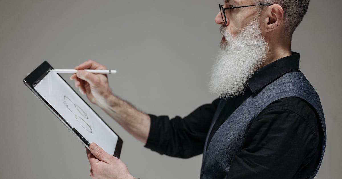 How do I carry my Draw Something contacts from my old iPad to my new iPad? - A Bearded Businessman  Drawing on a Tablet with a Stylus