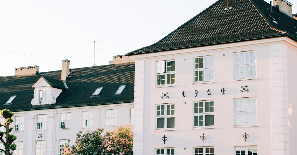 How do I change a type of block in a specific area into another block? [duplicate] - Facade of aged apartment building with white walls located in green area of town