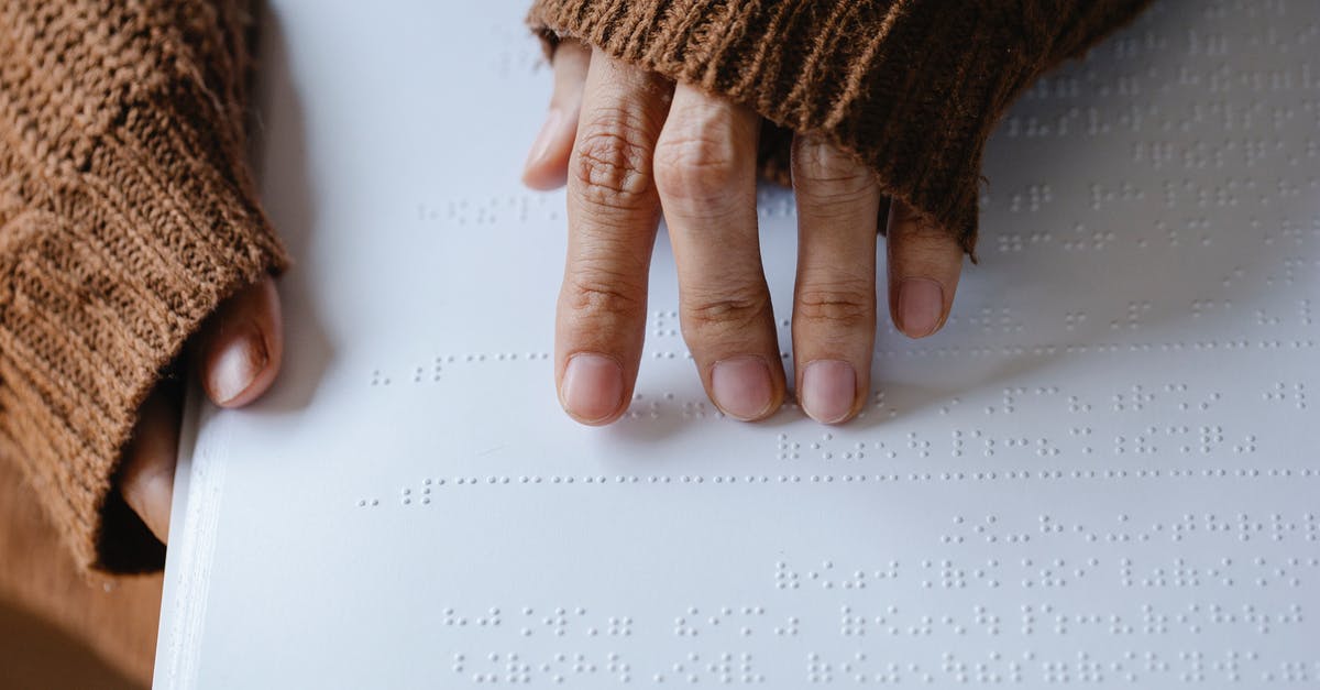 How do I change characters on The Binding of Isaac? - Photo of Person Using Braille How do I change characters on The Binding of Isaac? - Photo of Person Using Braille