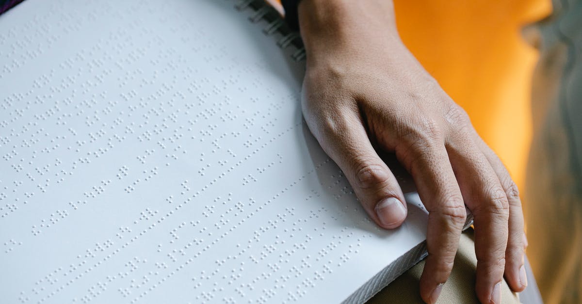 How do I change characters on The Binding of Isaac? - Photo of Braille on Person's Lap How do I change characters on The Binding of Isaac? - Photo of Braille on Person's Lap