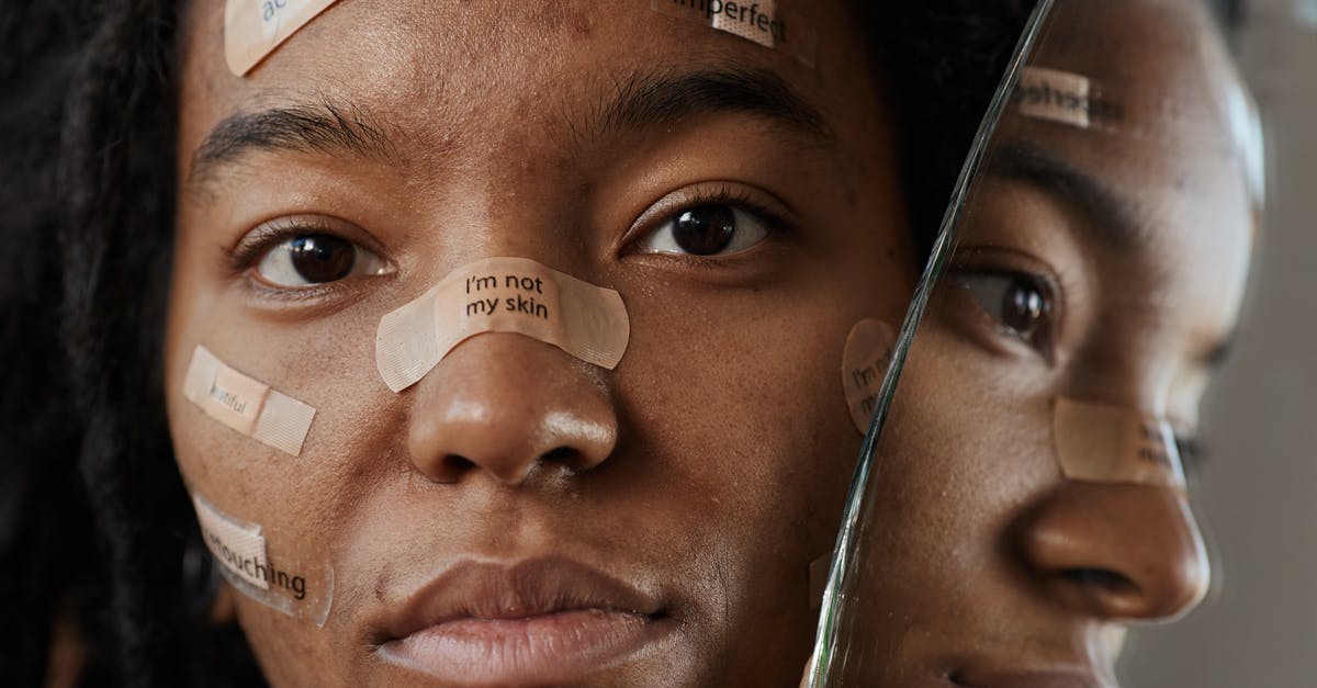 How do I change my skin? - A Woman Protesting with Messages on Band Aids 