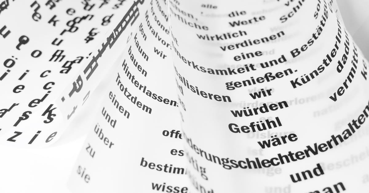 How do I change the language of the German version of Fallout 3 to English? - From above of white sheets of paper with curled edges and black written words placed on white background in light room