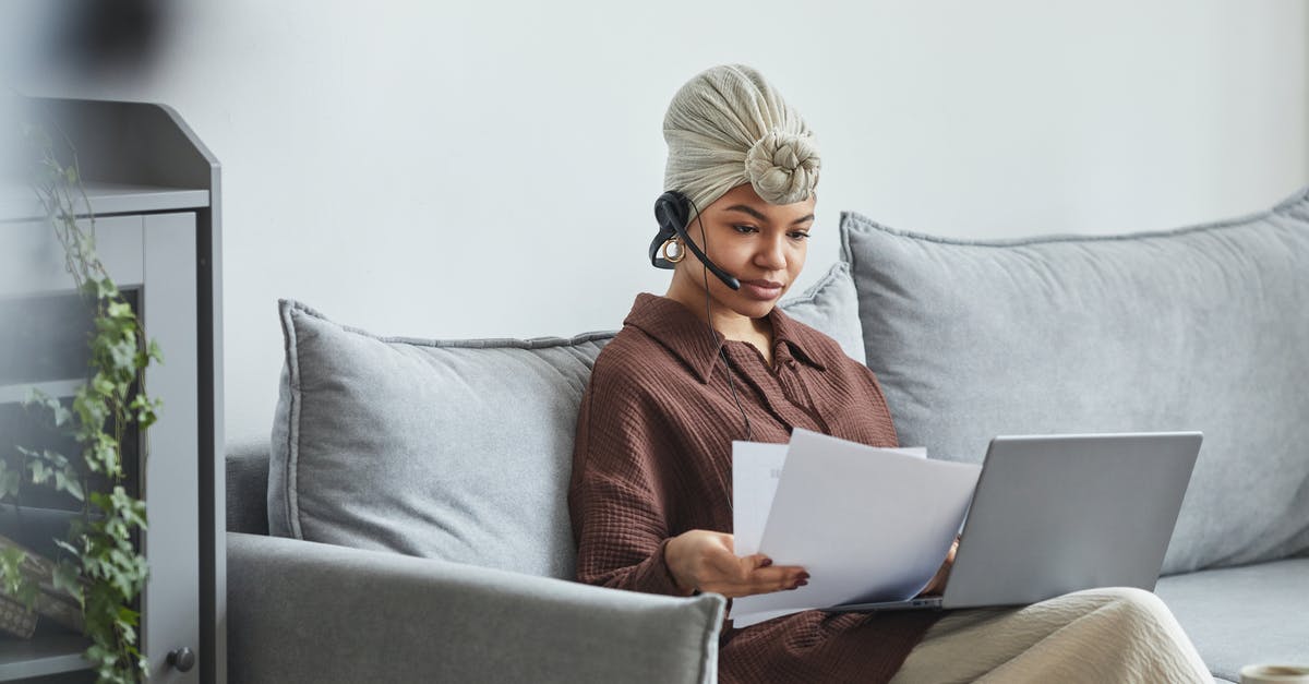 How do I check if my GPU supports Raytracing? - Focused black woman with laptop examining documents How do I check if my GPU supports Raytracing? - Focused black woman with laptop examining documents
