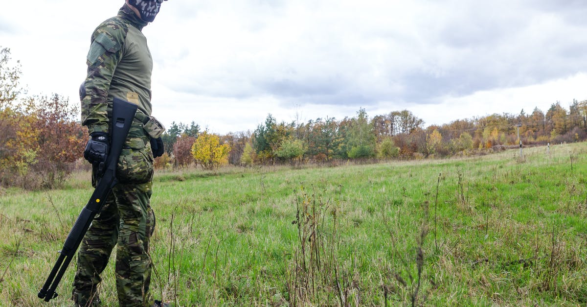 How do I combine weapons with special characteristics? - Photo of Man Wearing Green Combat Uniform Holding Rifle