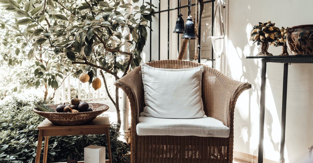 How do I complete the fourth maze in the garden of the Parfum Palace? - Wicker chair with cushion placed near lemon tree