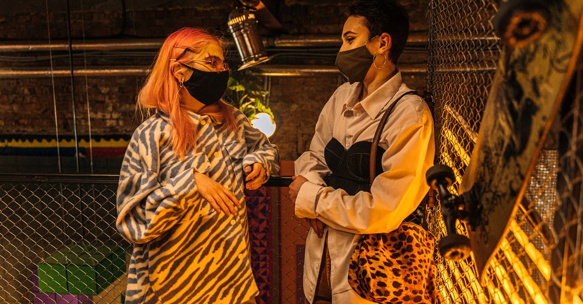 How do I complete the Taking Independence quest? - Two Women in Face Masks Talking in an Industrial Style Interior