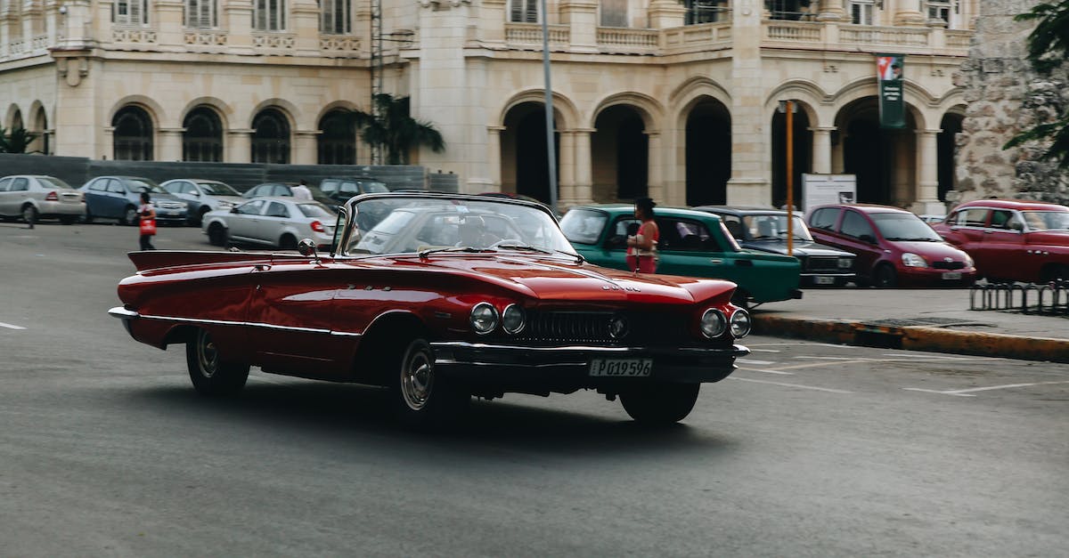 How do I convert or upgrade roads? - Red Convertible Car on Road