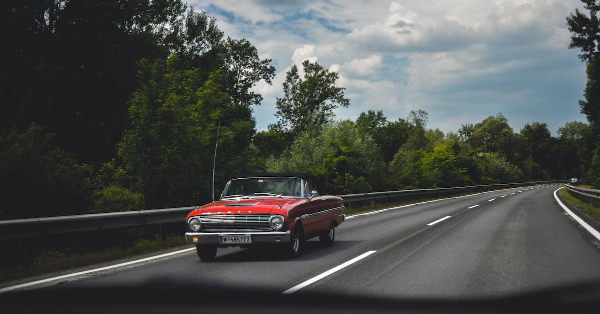 How do I convert or upgrade roads? - Photography of Red Car on Road
