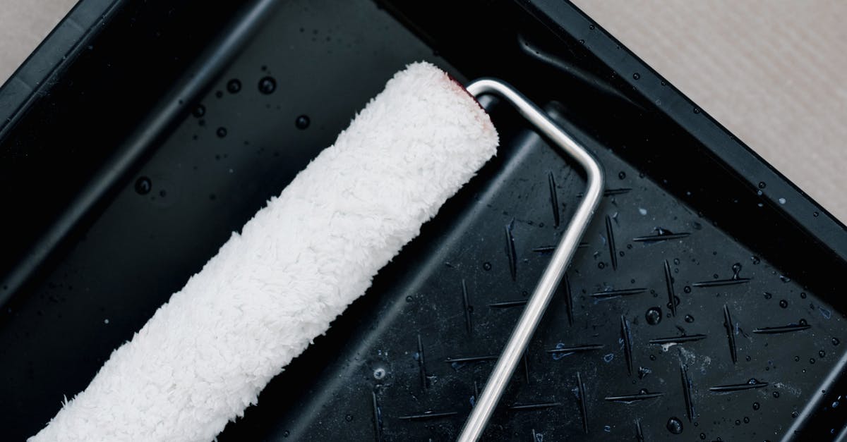 How do I create a backup save? - From above of clean roller for repair on plastic tank for paint at home How do I create a backup save? - From above of clean roller for repair on plastic tank for paint at home