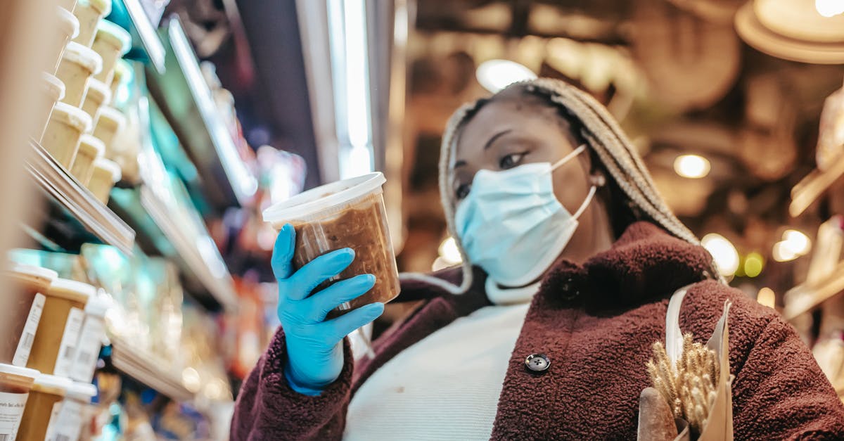 How do I customize the controls? - Black woman in protective mask buying products