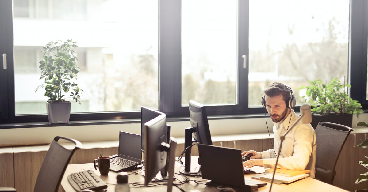 How do I delete a custom room? - Man With Headphones Facing Computer Monitor