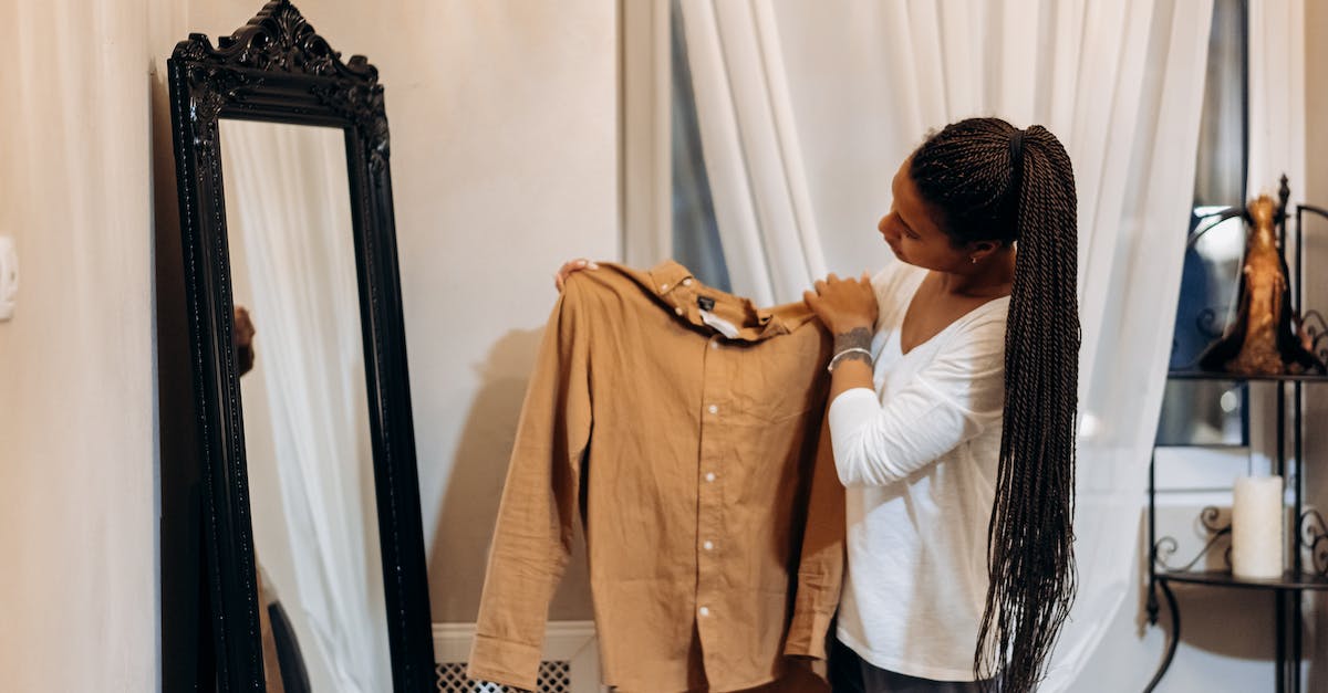 How do I delete a specific item thrown on the ground? - A Woman Checking a Brown Long Sleeves Shirt How do I delete a specific item thrown on the ground? - A Woman Checking a Brown Long Sleeves Shirt