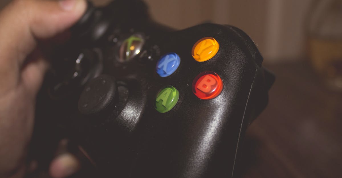 How do I delete gamer profile on xbox 360 [duplicate] - Person Holding Black Xbox One Controller