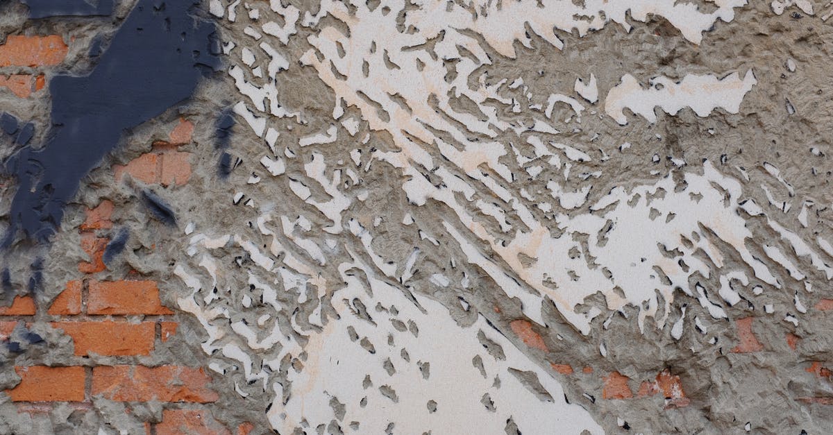 How do I destroy a block on a computer version of minecraft? [closed] - Background of white shabby painting on concrete and brick wall on street in city