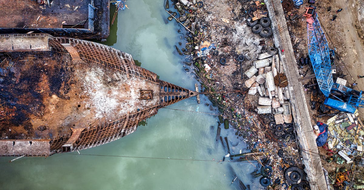 How do I destroy a ship realm in the Archimedes' Ships mod? - Aerial view of abandoned rusty ship moored in sea near dirty coast full of garbage in industrial area in sunlight How do I destroy a ship realm in the Archimedes' Ships mod? - Aerial view of abandoned rusty ship moored in sea near dirty coast full of garbage in industrial area in sunlight